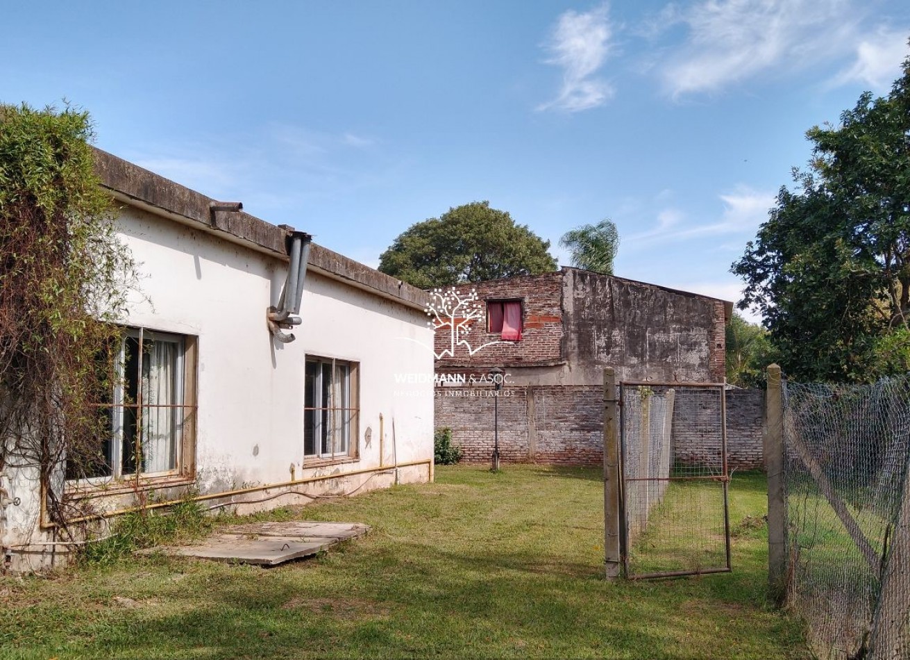 Gran predio con casa y quincho, salida a 3 calles, Santo Tome